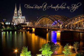 Cologne, Germany at night with the bridge lit up